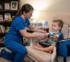 Pediatric home nurse providing trach care during RSV and flu season