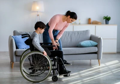 young-mother-helping-her-disabled-teen-son-in-whee-2022-12-16-08-00-13-utc-scaled-1